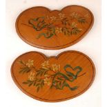 A pair of painted satinwood kidney shaped panels, late 19th century, each polychrome decorated