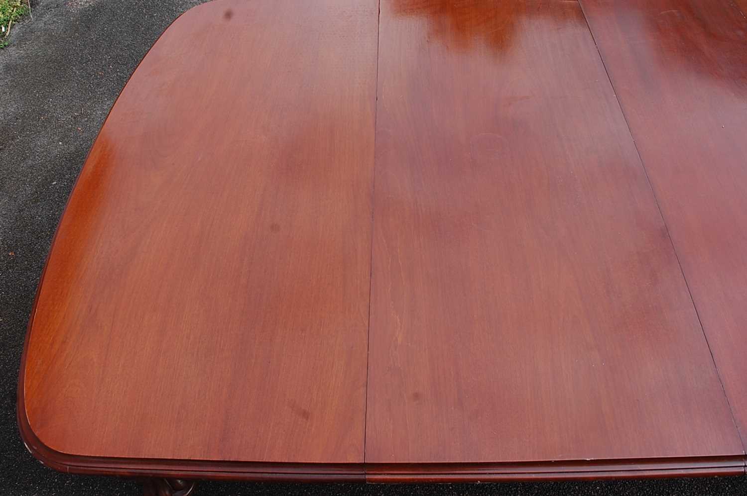 A Victorian mahogany extending dining table, of good size, the top having double wind-out action, - Image 2 of 7