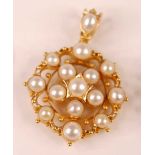 A yellow metal openwork oval cluster pendant, set with fifteen 3.75 to 5mm mabe pearls, with a split