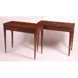 A pair of Regency rosewood D-shaped card tables, each with fold-over tops opening to reveal baize