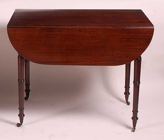 A late Georgian mahogany Pembroke table, having single end frieze drawer and raised on ring turned