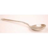 A Russian silver spoon, the reverse of the bowl engraved with leaves and flowers, monogrammed