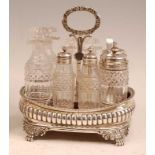 A George III silver eight-bottle cruet, of reeded oval bombe form, with gadrooned rim and lion paw