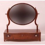 A Regency mahogany, boxwood inlaid and rosewood crossbanded dressing table mirror, having bowfront