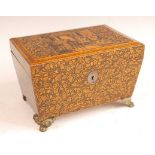 A Regency satinwood and penwork tea caddy, the hinged cover decorated with an interior family
