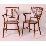 A near-pair of 19th century elm seat and fruitwood Mendlesham chairs, each having ball and pierced