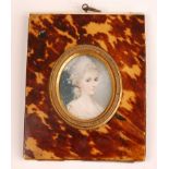 19th century English school - Bust portrait of a young woman wearing her hair up, miniature