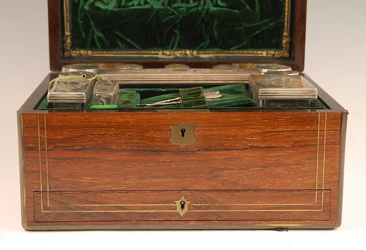 A Victorian rosewood and brass bound fitted toilet box, the hinge cover opening to reveal velvet - Image 4 of 5