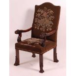 A Victorian carved oak and upholstered armchair, in the 17th century style, having carved Chinese