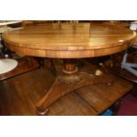 A William IV rosewood pedestal breakfast table, the circular tilt-top to a tapering column on a