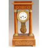 A late 19th century French rosewood and marquetry inlaid portico clock, the unsigned white enamel