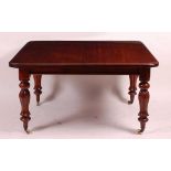A Victorian mahogany extending dining table, the pull-out top having a moulded edge and two extra