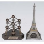 An Atomium Brussels 1958 desk weight, the white metal molecular structure on a marble base with