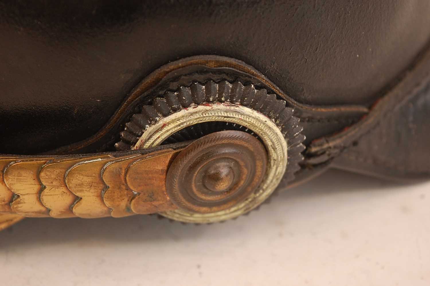 A Prussian pickelhaube, the leather skull with brass ball top and eagle plate, flanked by state - Image 4 of 9