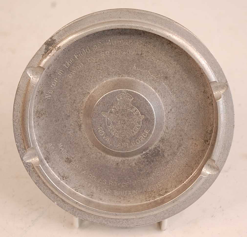 An R.A.F. Battle of Britain commemorative ashtray made from the piston of a Rolls Royce Merlin,