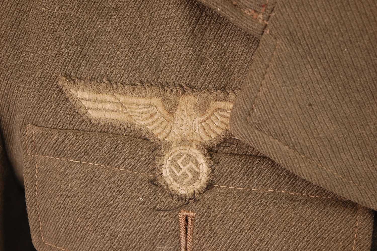 A German Army tunic, in green having four pleated pockets with pebble effect buttons and War Service - Image 8 of 14