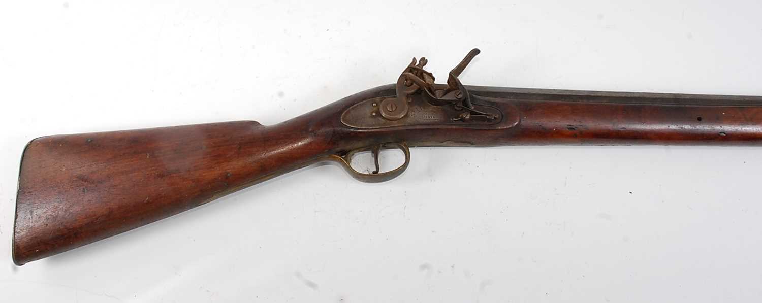A large early 19th century flintlock rifle, the 133cm barrel marked Dublin and numbered F2905, the