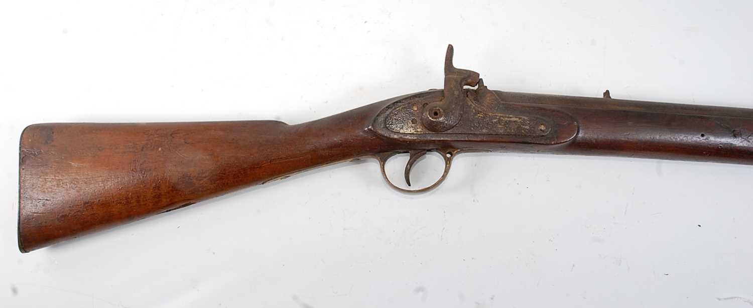 A 19th century percussion rifle, having an 85cm barrel, unmarked lock and brass mounted walnut