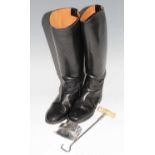 A pair of Regent ladies black leather calf length riding boots, size 6, with a polished steel boot