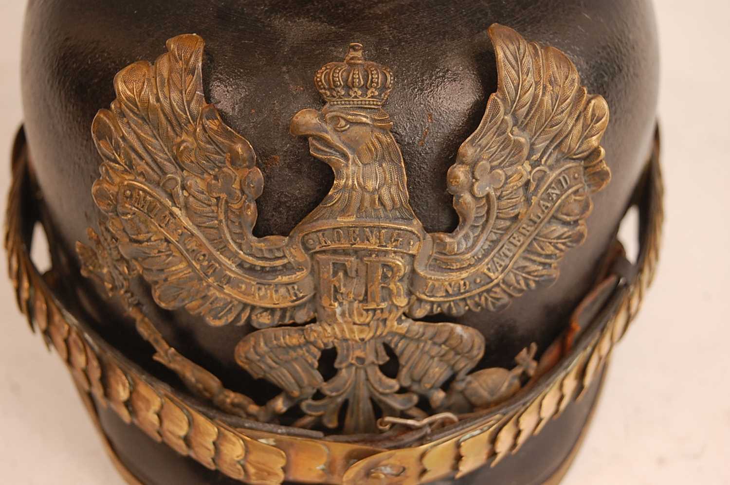 A Prussian pickelhaube, the leather skull with brass ball top and eagle plate, flanked by state - Image 2 of 9