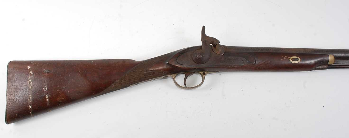A 19th century percussion Snider breech loading rifle, having a 96cm barrel with ram-rod below,