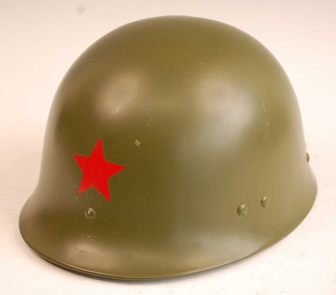 A Chinese Peoples Republican Army paratrooper's helmet, having a red star to the crown with