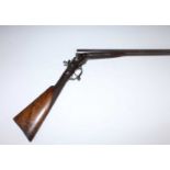 A late 19th century side by side under-lever action 12 bore shotgun, the 28" Damascus barrels marked