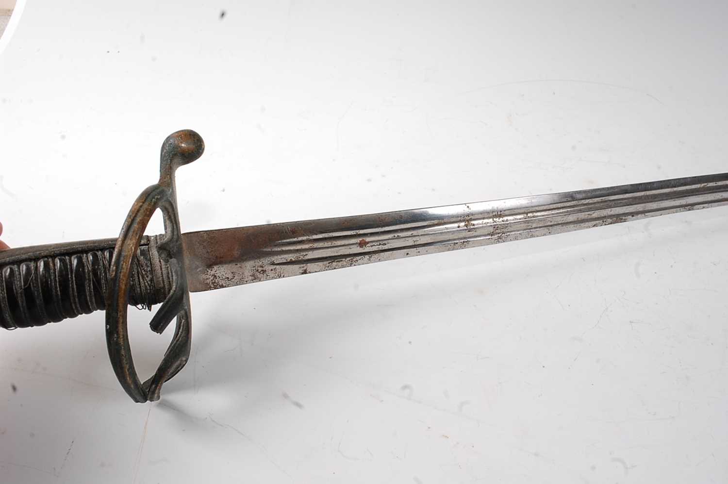 A 19th century sword, having an 81cm straight double fullered blade with the remains of a three - Image 3 of 7