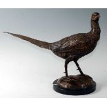A contemporary bronzed model of a pheasant in standing pose on a domed base and marble plinth, h.