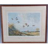 John Cyril Harrison, (1898-1985), Partridges in flight over a cornfield, coloured print, signed in