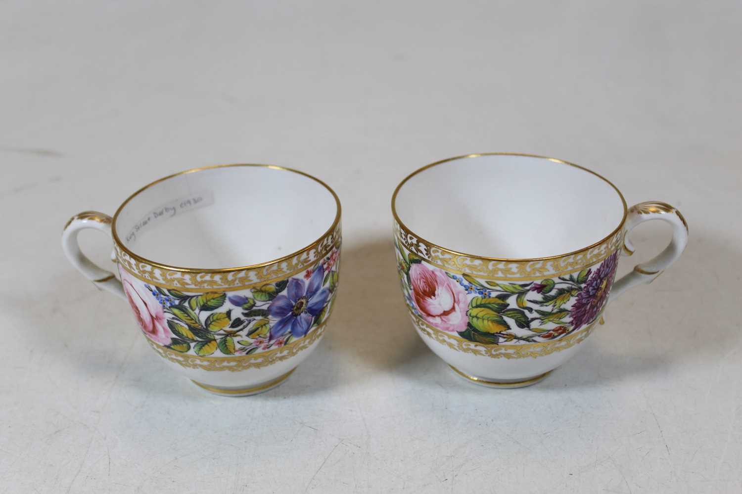 An early 19th century English porcelain tea bowl and saucer, enamel decorated with flowers, probably - Image 2 of 4