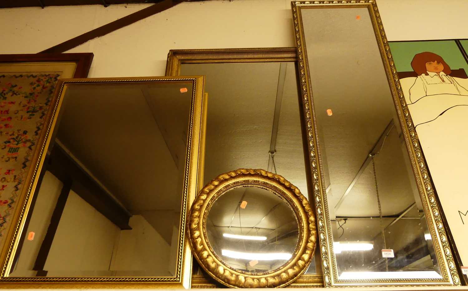 A modern gilt framed and bevelled rectangular wall mirror, 122x37cm; together with three other