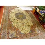 An extremely large Persian cream ground woollen Tabriz carpet, having multiple trailing tramline