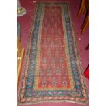 A Turkish woollen red ground kilim hall runner, 212 x 85cm