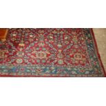 A Persian red ground woollen rugCondition report: Width 164cm, length 240cm.With some age related