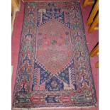 A Persian woollen blue ground Turkoman rug, 150 x 91cm