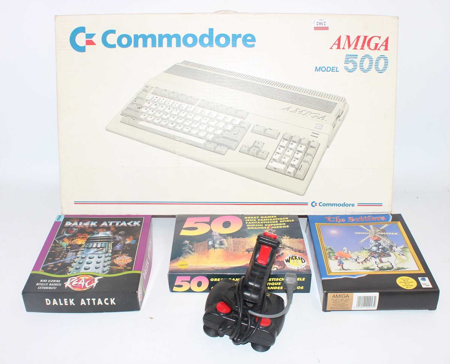 A boxed Commodore Amiga 500 model electronic computer, sold with three various boxed games and