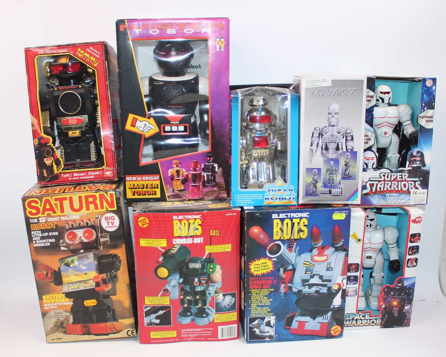 Nine various boxed battery operated and clockwork tinplate and plastic robots and space toys,