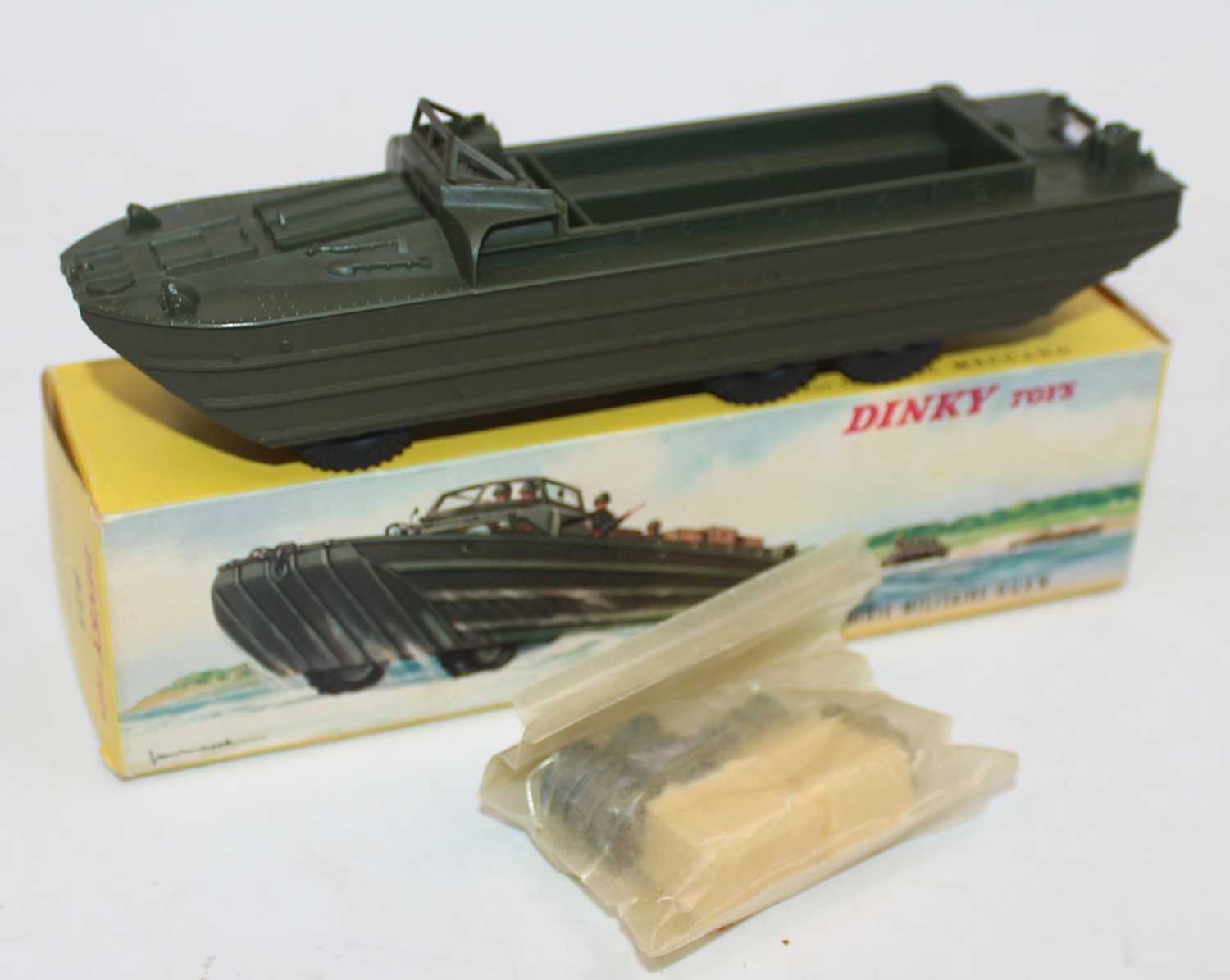 French Dinky Toys 825 G.M.C DUKW Amphibian, matt drab green, driver, 3x drums and 2x crates, mint