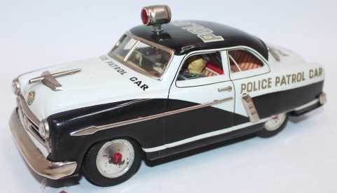 Marusan Kosuge tinplate and battery operated model of a Police Patrol Car, black and white body with