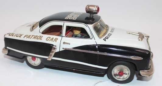 Marusan Kosuge tinplate and battery operated model of a Police Patrol Car, black and white body with - Image 2 of 2