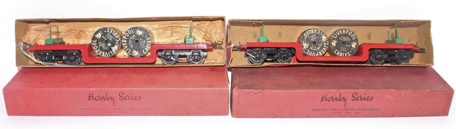 Two 1937-9 Hornby trolley wagons, plain red base, green stanchions, black bogies each with two loose