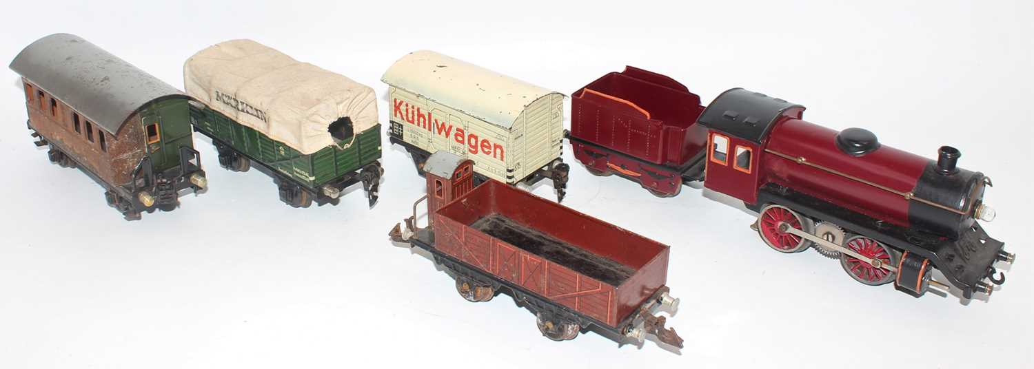 Tray containing Marklin items:- 0-4-0 loco and tender, electric motor, totally repainted dark red - Image 2 of 2