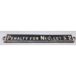 "Penalty for Neglect £2' cast iron sign, white on black, restored