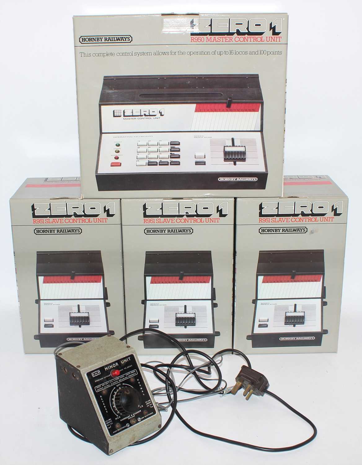 A collection of Hornby Railways Zero 1 master control units and slave control units, housed in the