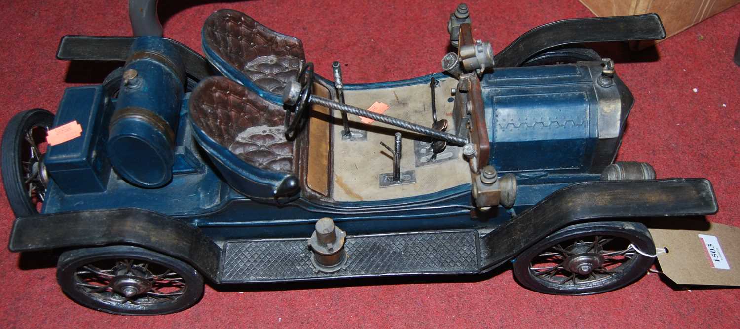 A scale model of a 1920s two-seater sports car