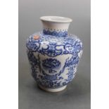 A Chinese export blue and white vase, the everted rim above a waisted body, decorated with birds