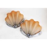 A pair of Art Deco chrome and glass wall lights, each in the form of a clam shell, h.25cm