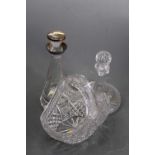 A cut glass ship decanter and stopper, h.25cm; together with a silver collared decanters, of conical