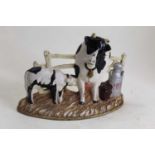 A cast iron doorstop in the form of a cow and calf, h.20cm